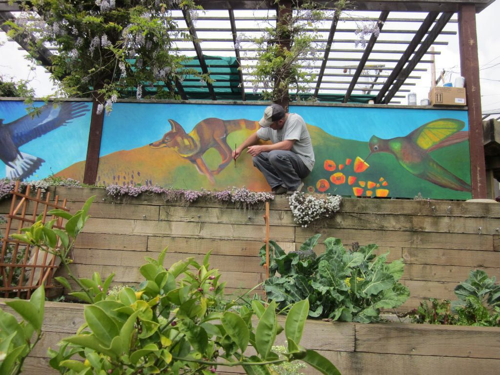 Ogden St Community Garden Mural finishing touches,  Designed and Painted by John Elliott  San Francisco, CA.  4’ X 21’   2011